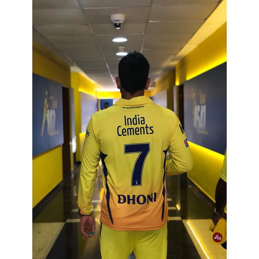 MS Dhoni in India Yellow Jersey Walking Through Stadium Tunnel HD phone wallpaper