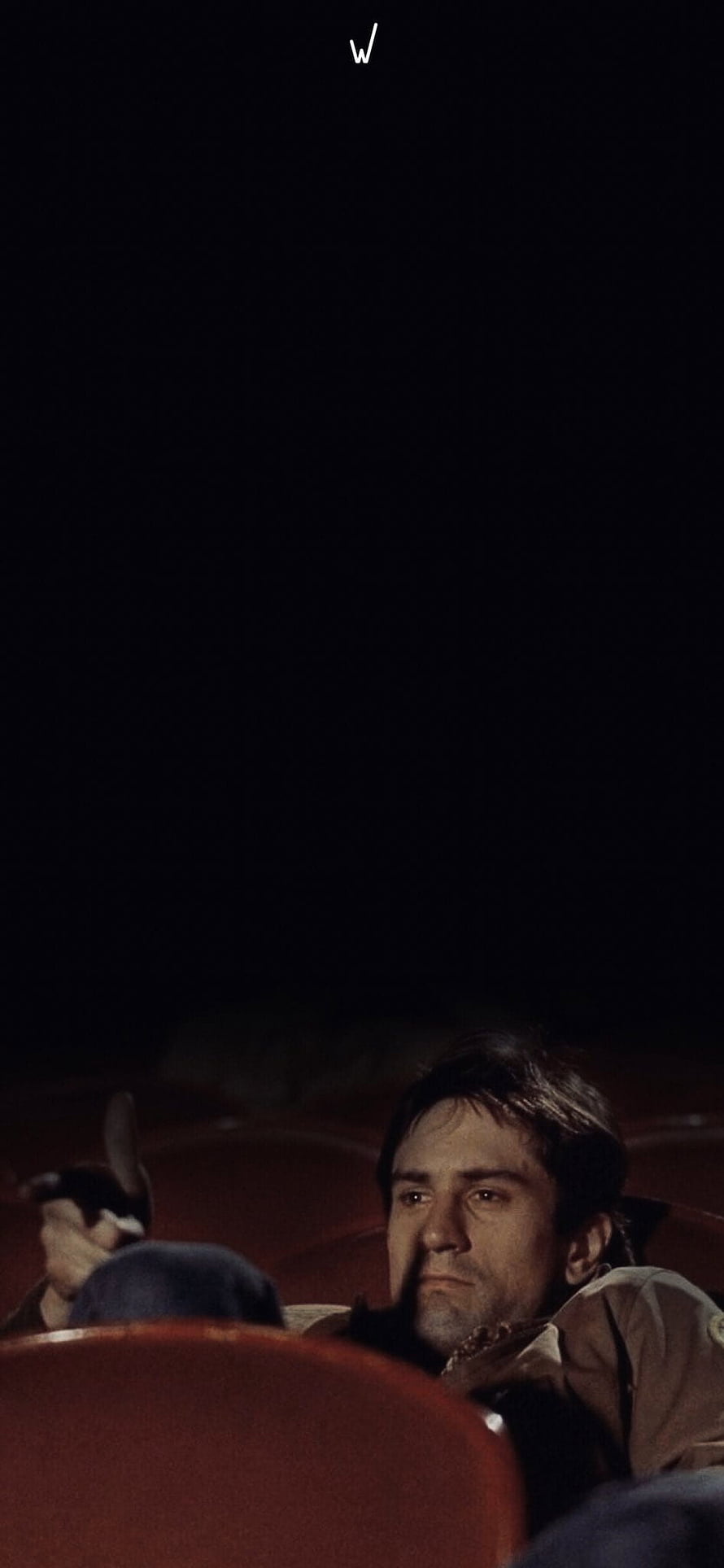 Travis Bickle in a dimly lit theater seat from Taxi Driver HD phone wallpaper