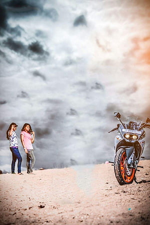 Two Women and a Sport Motorcycle on a Misty Mountain Ridge at Sunset HD phone wallpaper