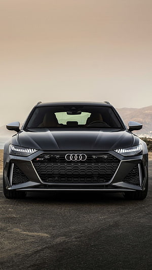 Audi RS6 Avant Front View in Matte Grey Against a Hazy Mountain Landscape HD phone wallpaper