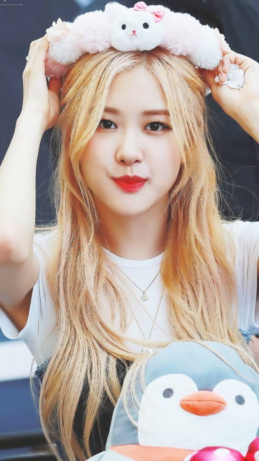 Rose from Blackpink Wearing a Fluffy Bunny Headband and Holding a Penguin Plushie HD phone wallpaper