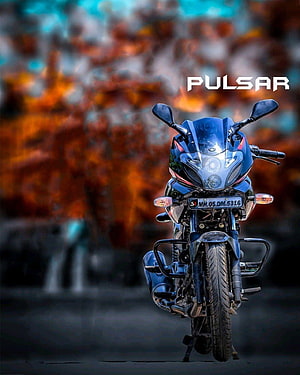 Blue Bajaj Pulsar Motorcycle Front View with Fiery Autumn Background HD phone wallpaper