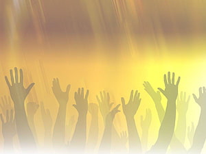 Silhouetted Hands Raised in Worship Against Golden Light Rays HD wallpaper