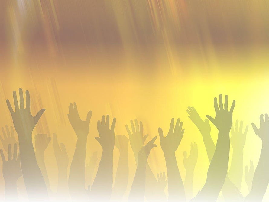 Silhouetted Hands Raised in Worship Against Golden Light Rays HD wallpaper