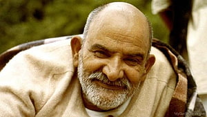 Neem Karoli Baba Portrait with White Beard and Warm Smile HD wallpaper
