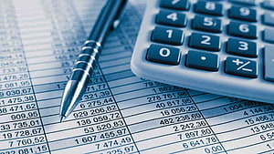 Financial Accounting Closeup with Calculator and Pen on Spreadsheet HD wallpaper