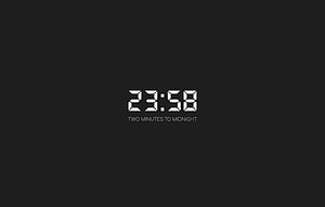 Minimalist Digital Clock Displaying 23:58 with Midnight Countdown Text on Dark Background HD wallpaper