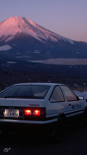 White Toyota AE86 Trueno Parked Before Snow-Capped Mount Fuji at Dusk HD phone wallpaper