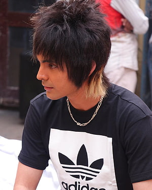 Young man with spiky hair and blonde highlights wearing a black Adidas t-shirt and chain necklace, Portrait graphy men ...in.pinterest, sukha HD phone wallpaper