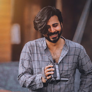 Afran Nisho Holding Vintage Camera in Plaid Shirt HD phone wallpaper
