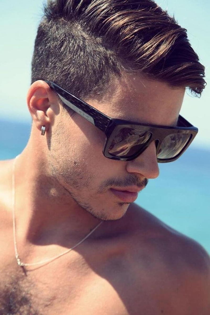 Close-up of a man with a modern fade haircut and sunglasses at the beach HD phone wallpaper