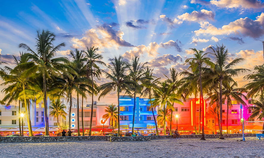 Miami Beach Ocean Drive at Dusk with Neon Art Deco Buildings and Palm Trees HD wallpaper