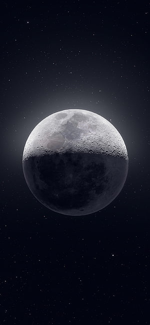 Gibbous Moon with Cratered Surface Floating in a Star-Filled Deep Space Sky HD phone wallpaper
