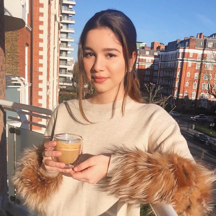 Sara Tendulkar Holding Coffee on a Balcony with City View HD phone wallpaper