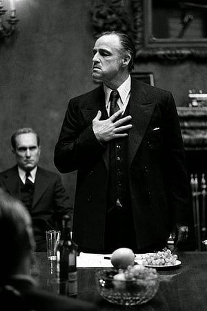 Don Vito Corleone in a Formal Black Suit During a Serious Meeting HD phone wallpaper