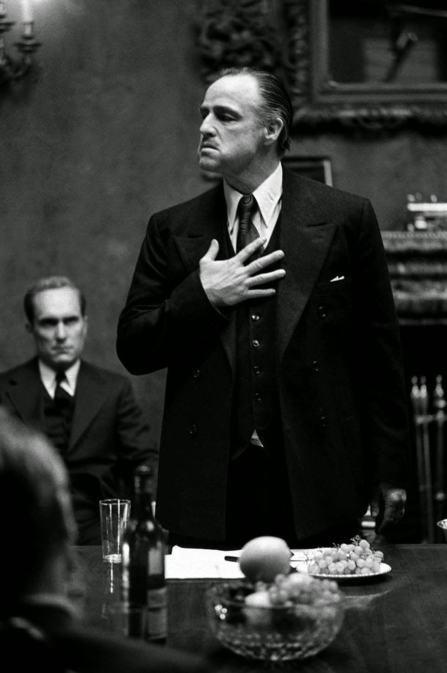 Don Vito Corleone in a Formal Black Suit During a Serious Meeting HD phone wallpaper
