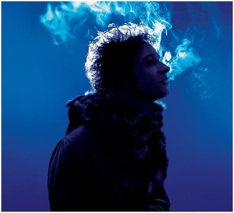 Gustavo Cerati Profile Portrait with Blue Smoke and Dramatic Lighting HD wallpaper