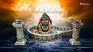 Mahakaleshwar Jyotirlinga adorned with vibrant floral garlands and ornate silver pedestals HD wallpaper