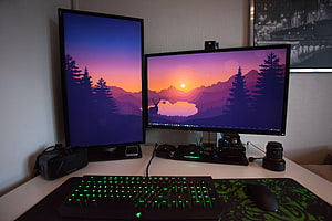 Dual Monitor Gaming Setup With Vertical Display And Green Backlit Keyboard HD wallpaper