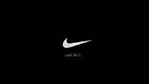 Nike Swoosh Logo with Just Do It Tagline on Black Background HD wallpaper