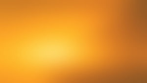 Warm Amber Gradient Background with Soft Golden Glow and Smooth Color Transitions HD wallpaper