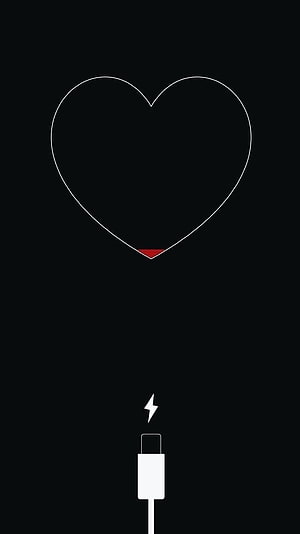 Minimalist Black Heart Charging Icon with Lightning Bolt on Dark Background HD phone wallpaper