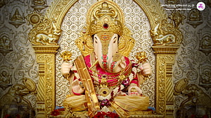 Dagdusheth Ganpati Murti Adorned In Gold And Marigold Garlands Within Ornate Temple Arch HD wallpaper