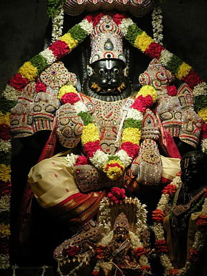 Lakshmi Narasimha Swamy Temple Idol Adorned With Vibrant Flower Garlands And Ornate Jewelry HD phone wallpaper