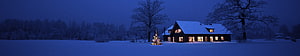 Cozy Snow-Covered Cabin at Night with Illuminated Christmas Tree in Winter Landscape HD wallpaper