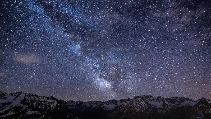 Milky Way Galaxy Arching Over Snow-Capped Mountain Ranges at Night HD wallpaper