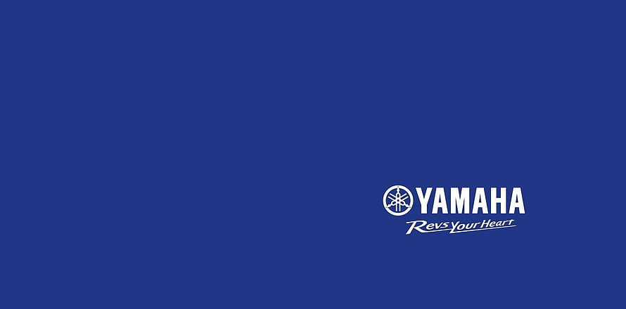 Yamaha Corporate Logo with Revs Your Heart Tagline on Solid Blue Background HD wallpaper