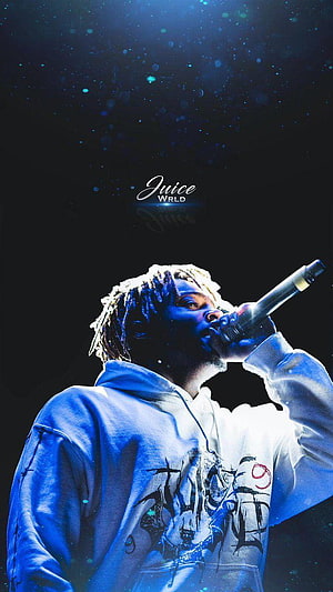 Juice WRLD performing live on stage in a white hoodie under blue concert lighting HD phone wallpaper