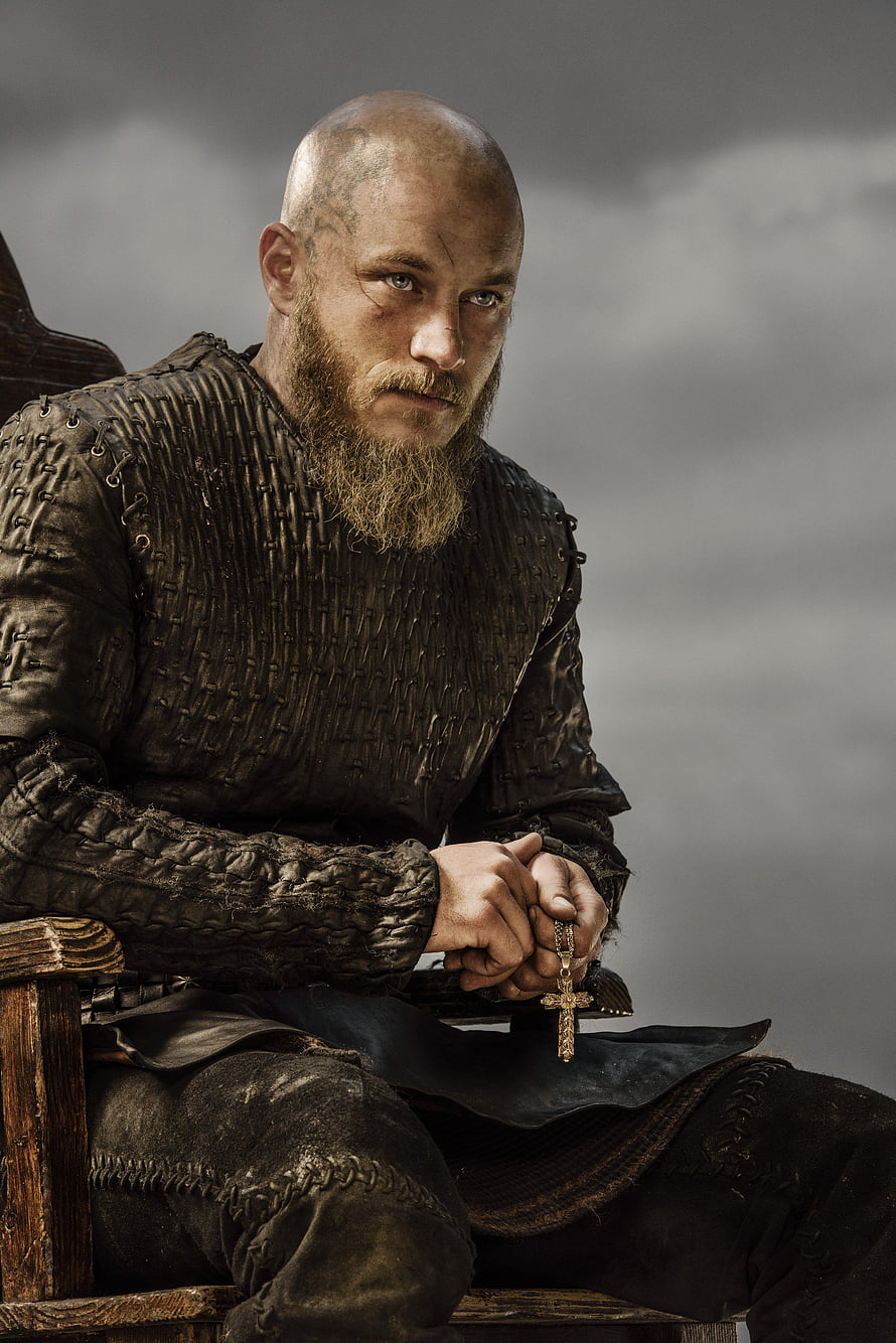 Ragnar Lothbrok in Dark Viking Armor Holding a Cross HD phone wallpaper