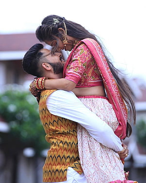 Romantic Indian Couple in Traditional Attire Sharing an Intimate Embrace HD phone wallpaper