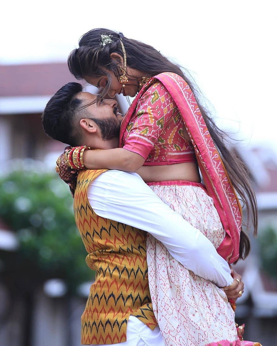 Romantic Indian Couple in Traditional Attire Sharing an Intimate Embrace HD phone wallpaper