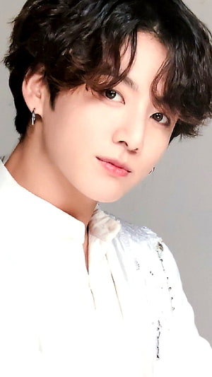 Jungkook of BTS in a white textured shirt with curly dark hair and hoop earrings HD phone wallpaper