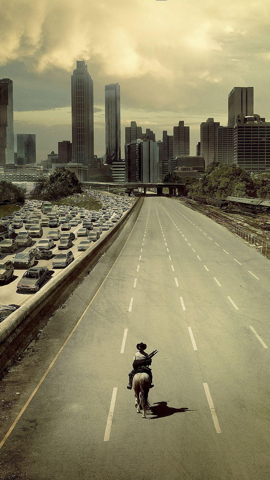 The Walking Dead Lone Rider on Empty Highway Amidst City Traffic Jam HD phone wallpaper