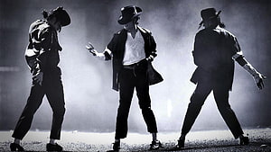 Michael Jackson performing in a black hat and jacket on a smoky stage HD wallpaper