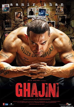 Ghajini Movie Poster Featuring Amir Khan with Intense Expression and Body Tattoos HD phone wallpaper