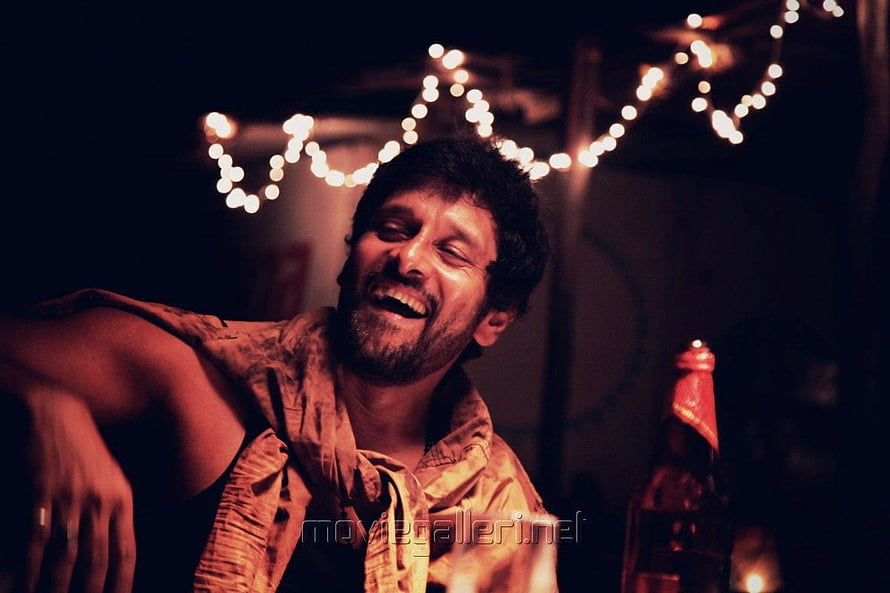 Vikram in David Tamil Movie Still with Festive Lights and Beer Bottle HD wallpaper