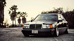 Black Mercedes-Benz W124 Stance Build with Low Profile Wheels and Palm Trees HD wallpaper