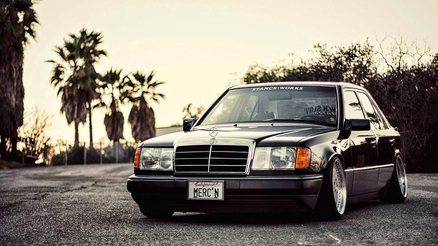 Black Mercedes-Benz W124 Stance Build with Low Profile Wheels and Palm Trees HD wallpaper