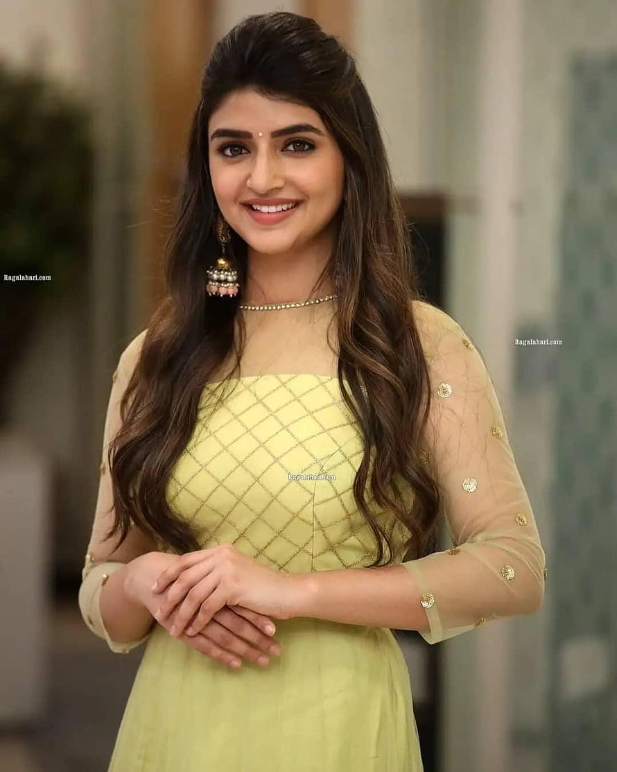 Sreeleela in a pastel yellow traditional dress with gold embroidery and elegant jewelry HD phone wallpaper