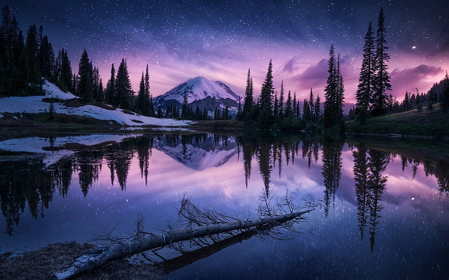 Starry Night Sky Over Snow-Capped Mountain Reflected in a Calm Alpine Lake HD wallpaper