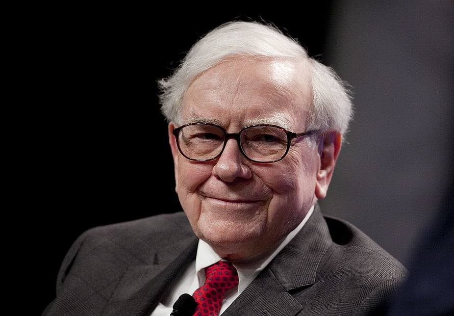 Warren Buffett in a grey suit and red tie smiling for a professional portrait HD wallpaper