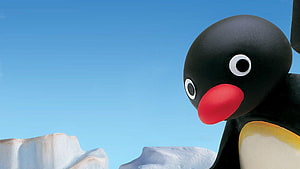 Pingu the Penguin in a Bright Arctic Landscape with Ice Floes and Clear Blue Sky HD wallpaper