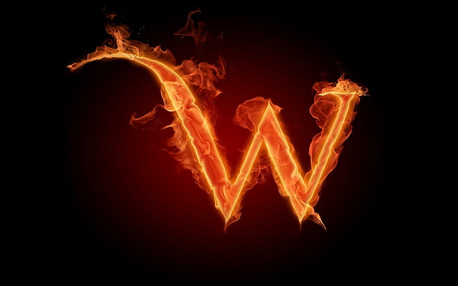 Flaming Letter W with Fiery Smoke Trails on a Dark Background HD wallpaper