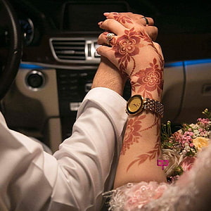 Couple Holding Hands With Henna Art Inside a Car During a Wedding Celebration HD phone wallpaper