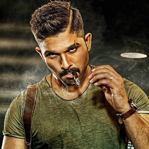 Allu Arjun as Surya in intense action pose with cigar and map background HD phone wallpaper