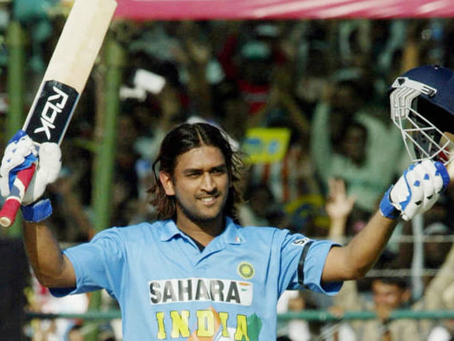 MS Dhoni Celebrating with Bat and Helmet in India Cricket Jersey HD wallpaper